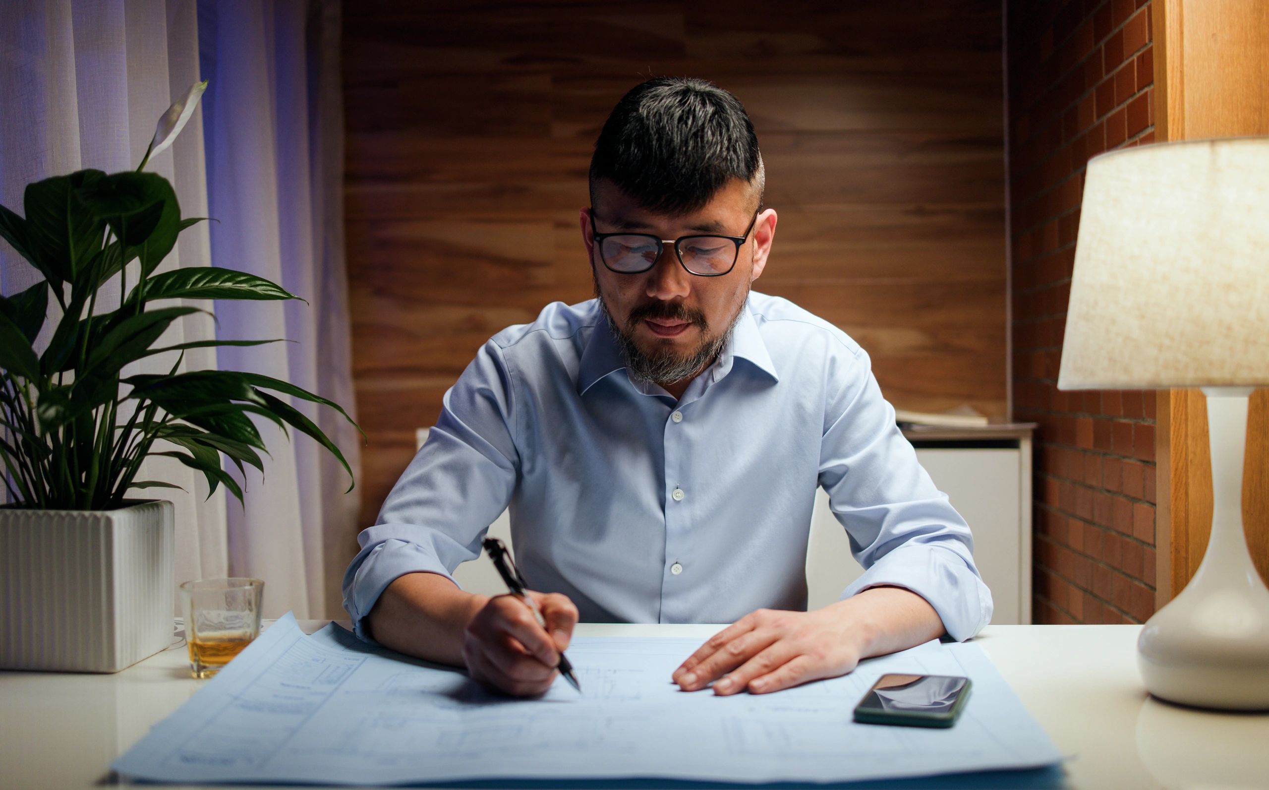 Professional team member speaking on the phone in an office